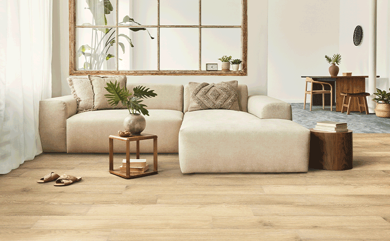 vinyl flooring light toned in living room with beige couch