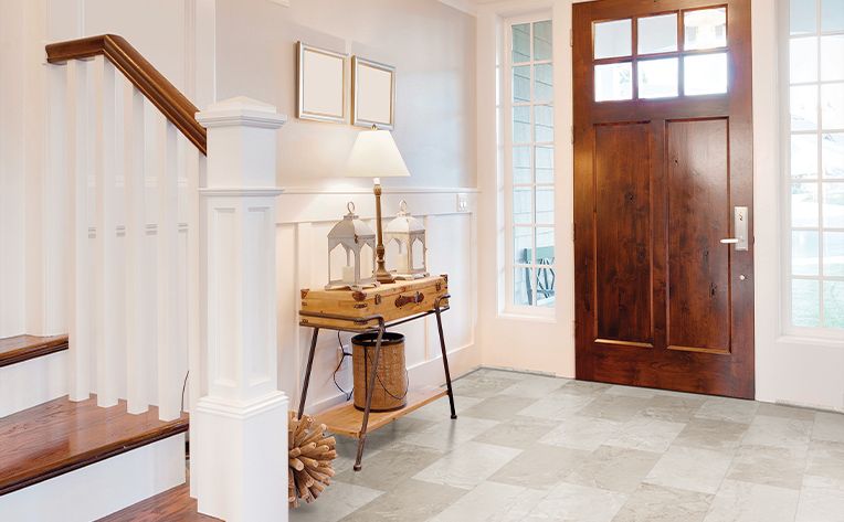 luxury vinyl tile entryway with wooden door